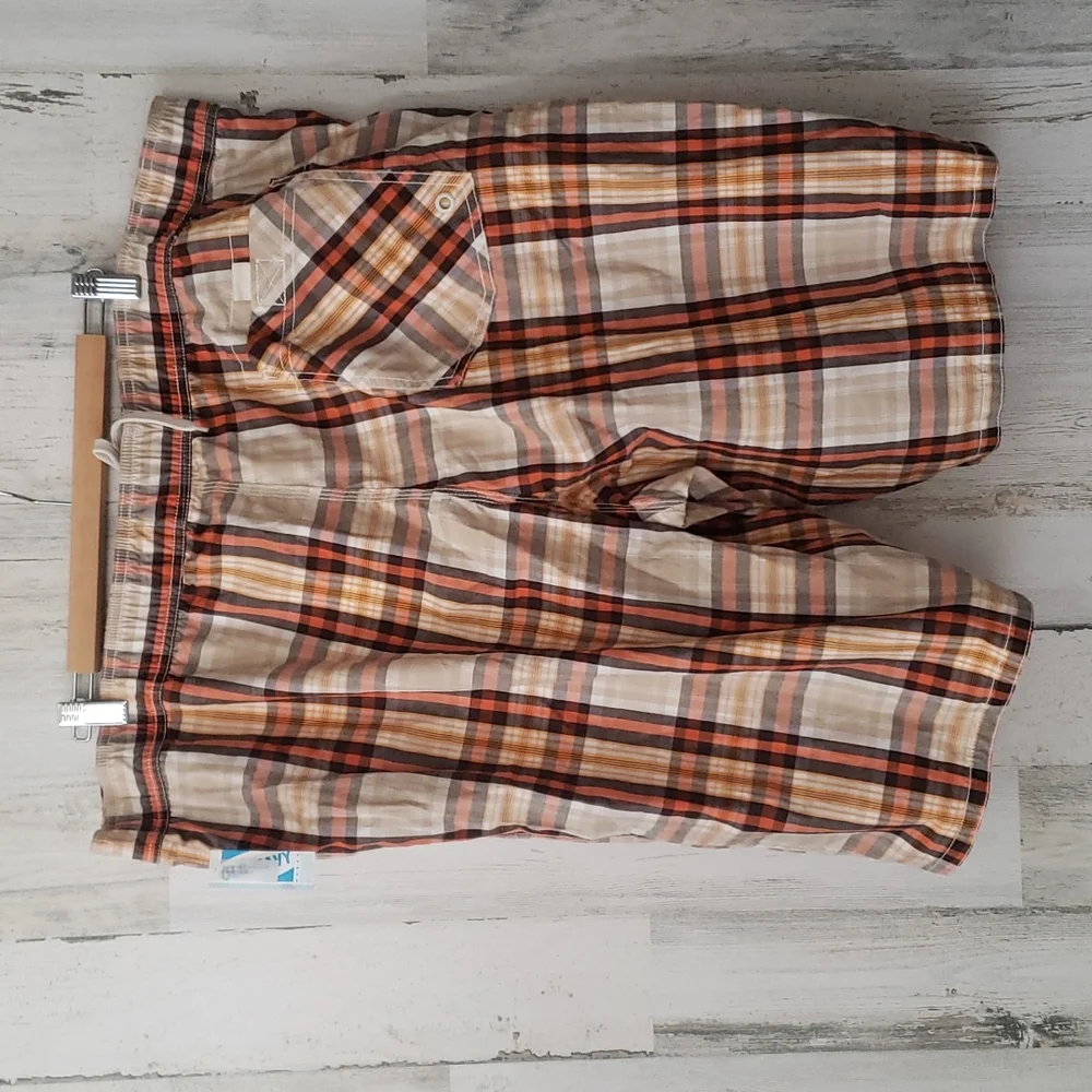 Old Navy plaid swim shorts tan, orange, brown. Pockets, built in brief. Size XXL